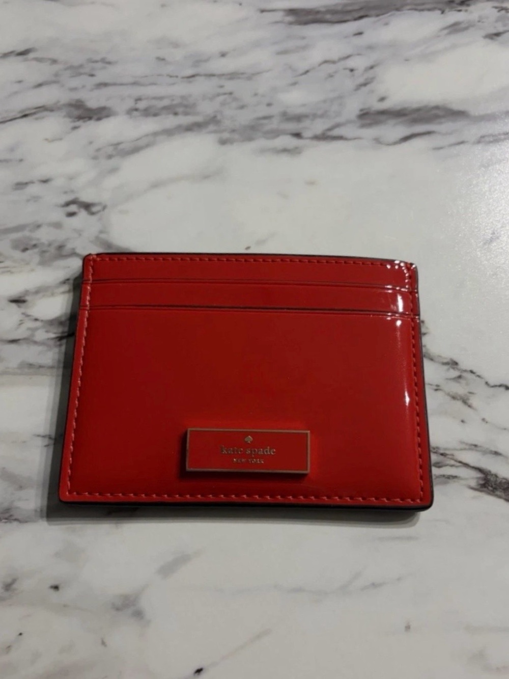 kate spade glossy red card holder with logo plaque NEW without tags